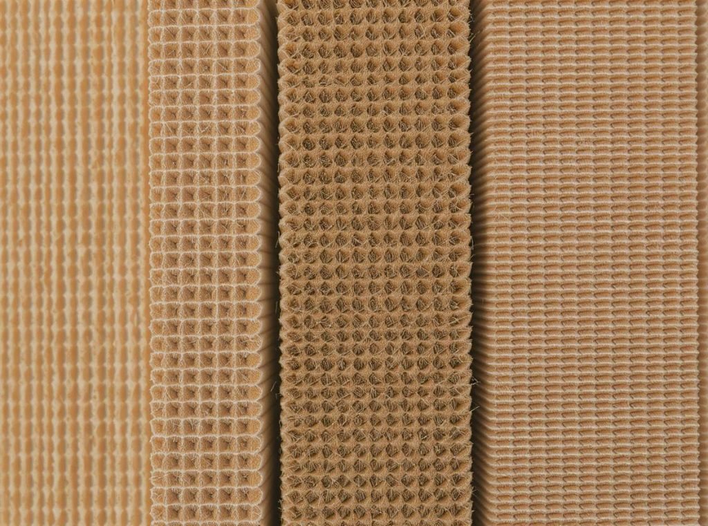 Cross-section view of different corrugated flute sizes showing internal wave structure for packaging selection