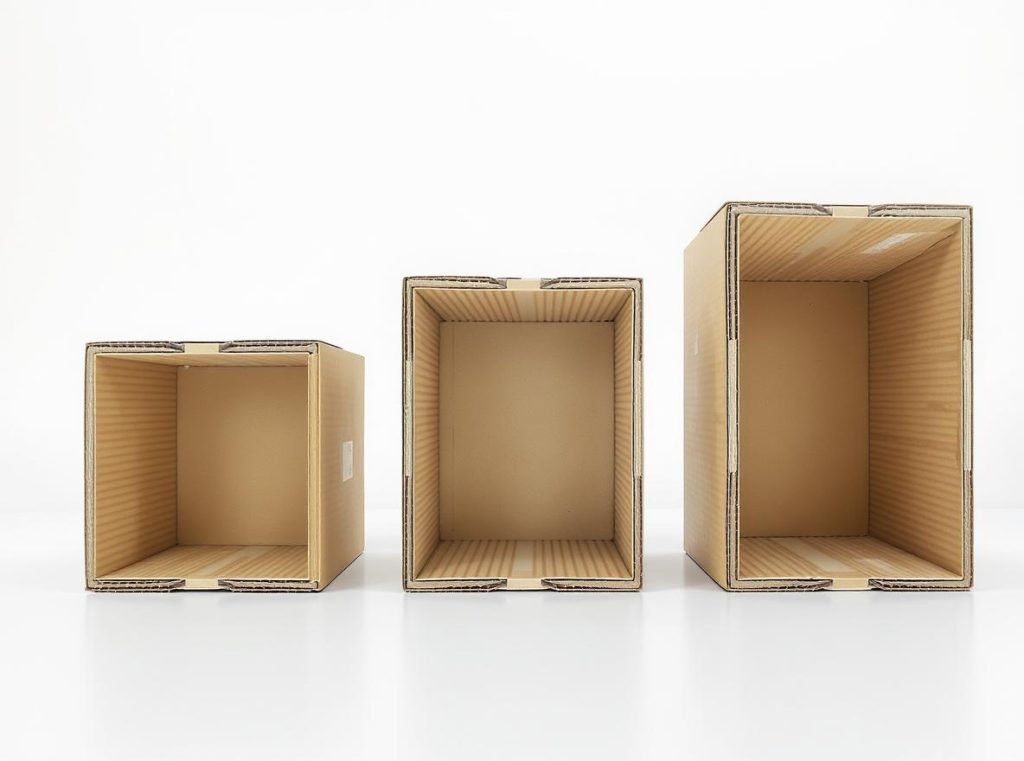 Cardboard box weight limits comparison showing single-wall, double-wall, and triple-wall construction cross-sections