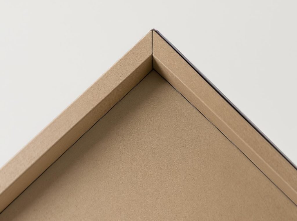 Detailed view of gable box triangular construction and cardboard material