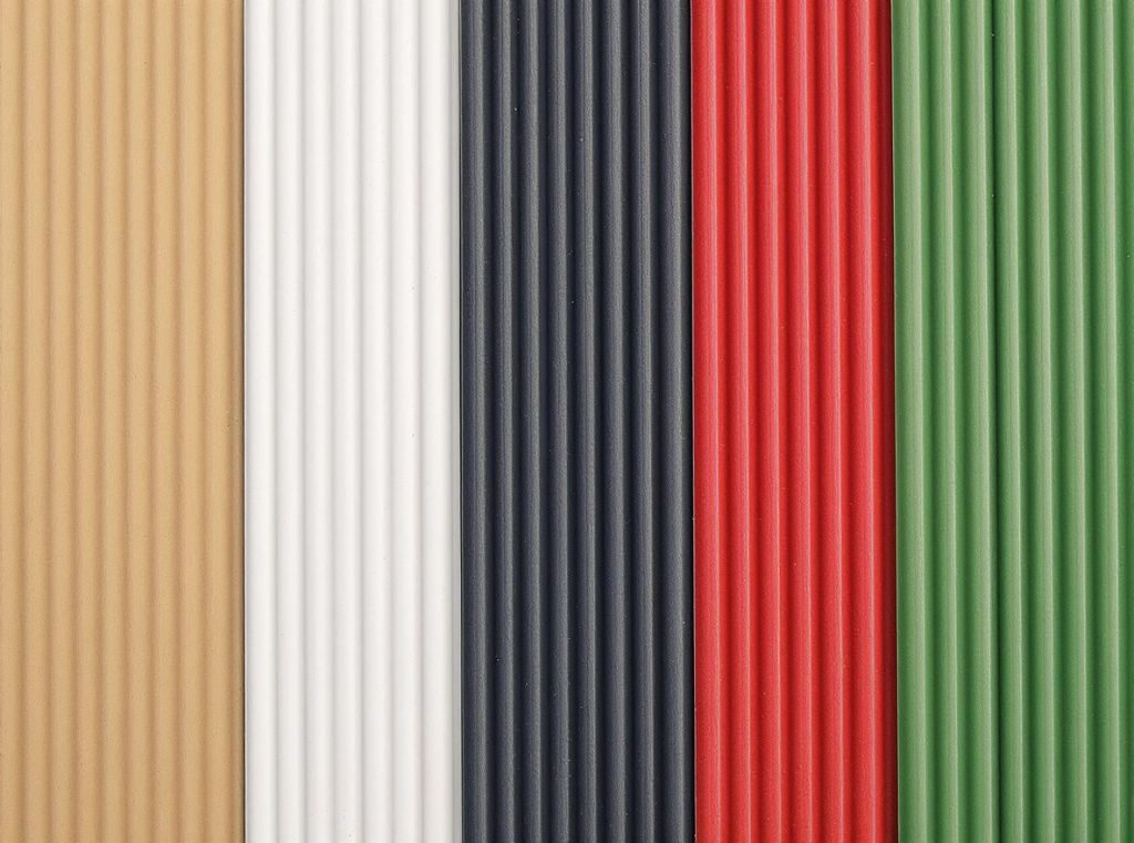Standard corrugated box base colors including brown kraft, white, black, and colored materials