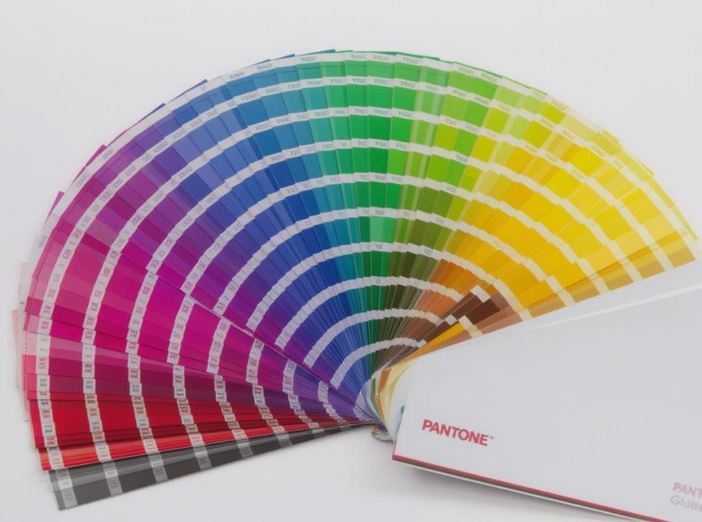 Pantone PMS color guide fan deck showing spot color printing swatches