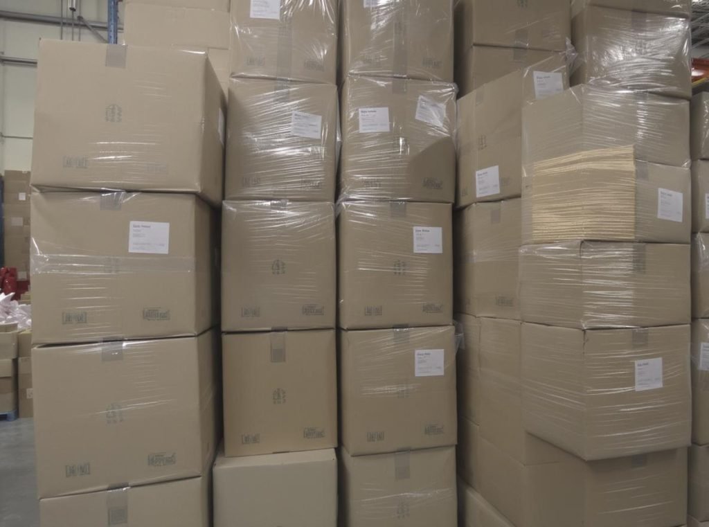 Flat-packed Five-Panel Folder boxes showing efficient warehouse storage