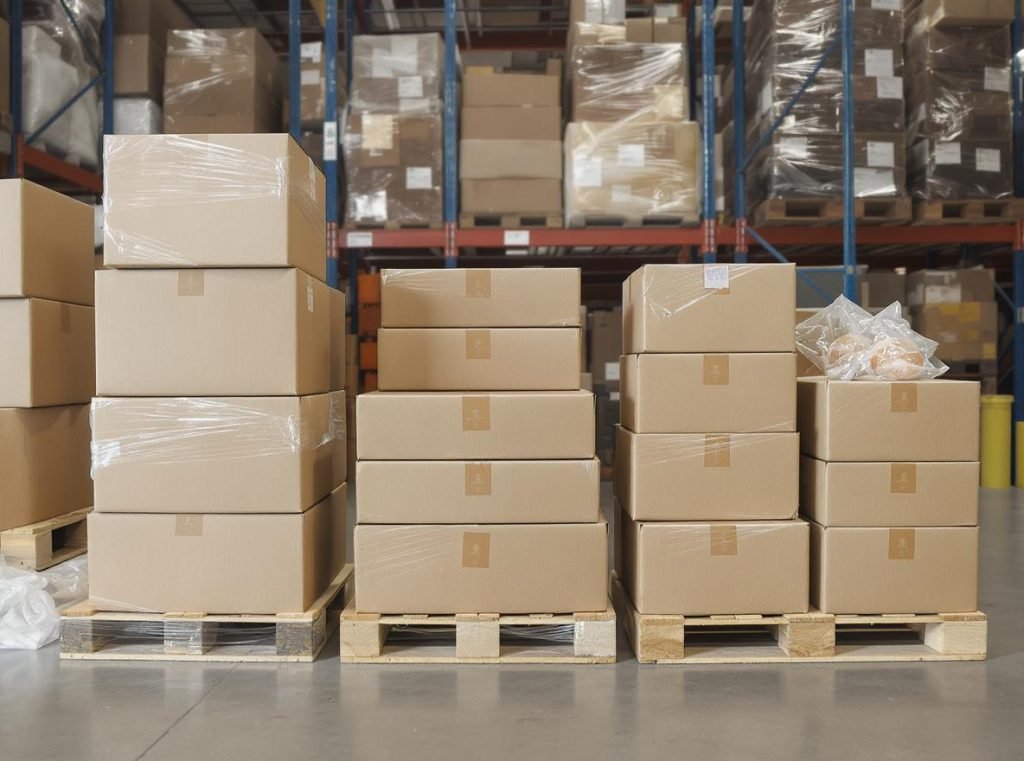 Minimum order quantity visualization showing stacks of custom packaging boxes representing different order volumes