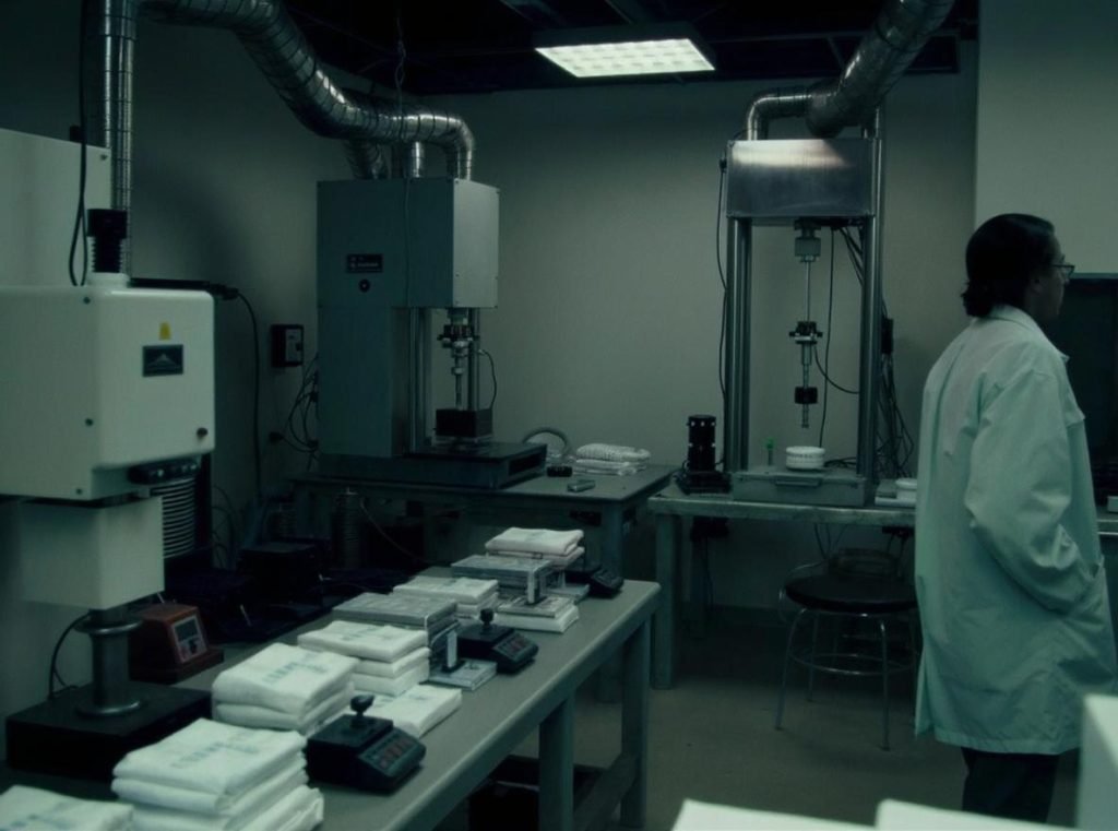 Laboratory testing environment with packaging samples undergoing quality evaluation tests