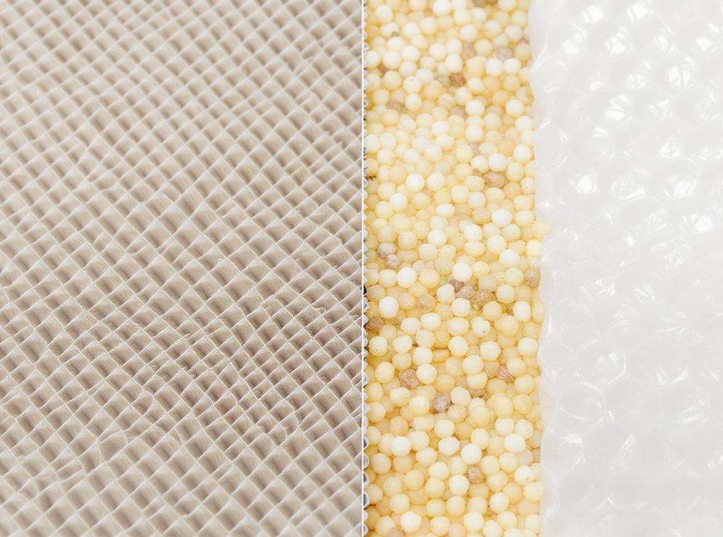 Close-up comparison of crinkle-cut paper accordion texture versus bubble wrap and foam packaging fillers
