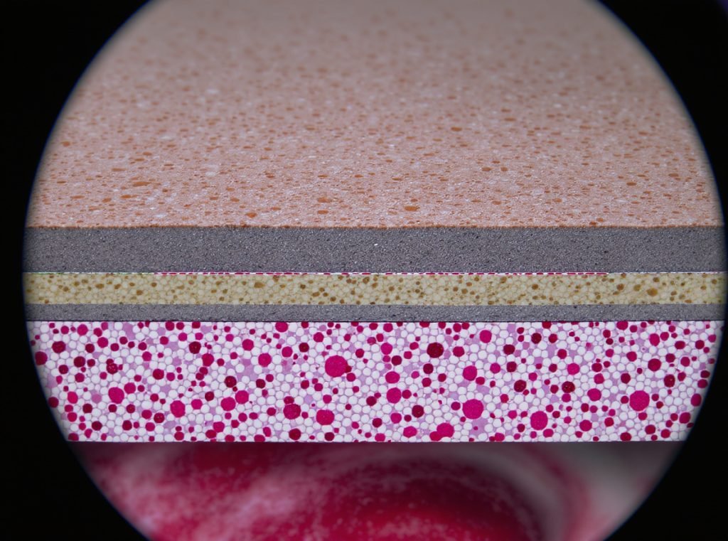 Cross-section view of coated paperboard showing surface coating impact on finishing